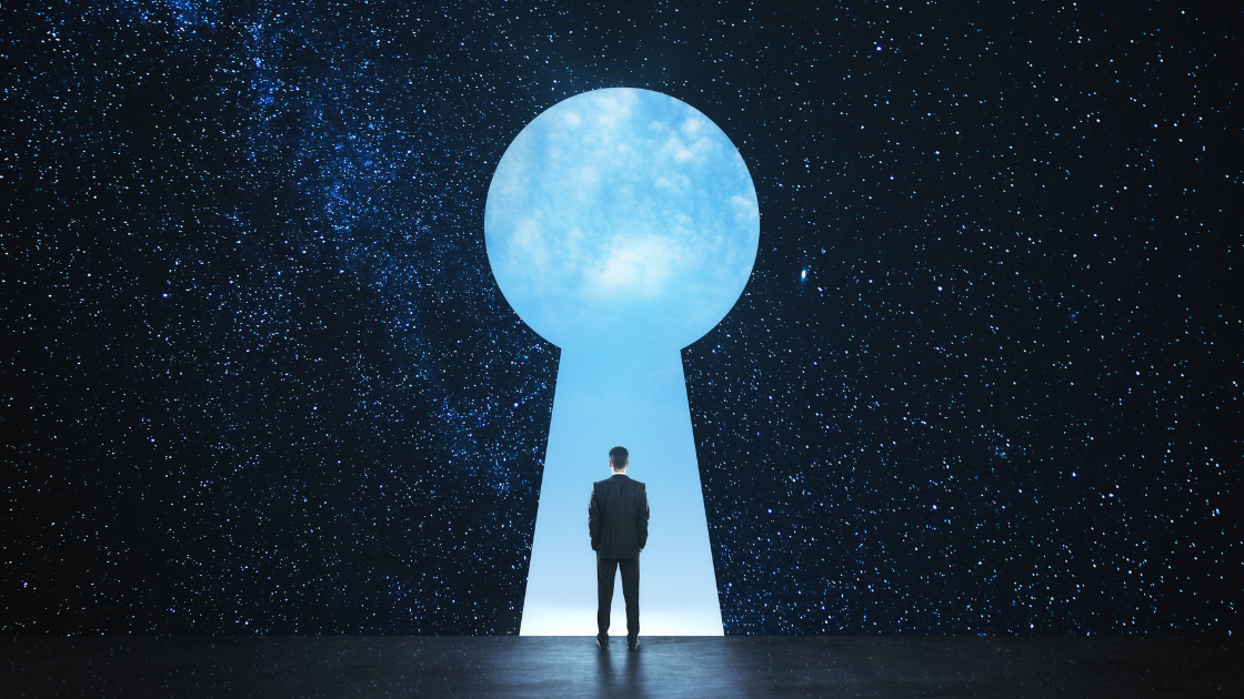 man entering a giant key hole in the sky - the inside of the key hole shows day time while the rest of the sky shows a night time sky full of stars