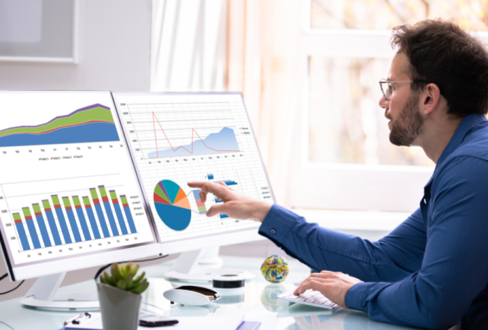 UK business professional analysing AI search changes data on laptop, representing calm strategic approach to digital marketing adaptation
