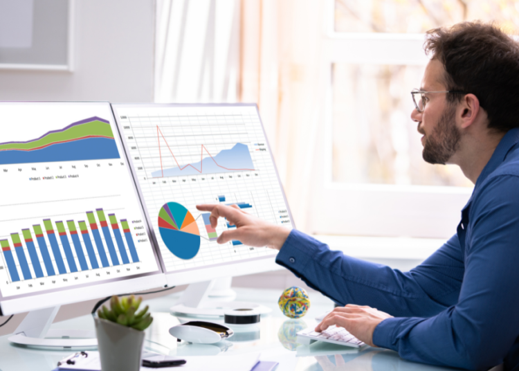 UK business professional analysing AI search changes data on laptop, representing calm strategic approach to digital marketing adaptation