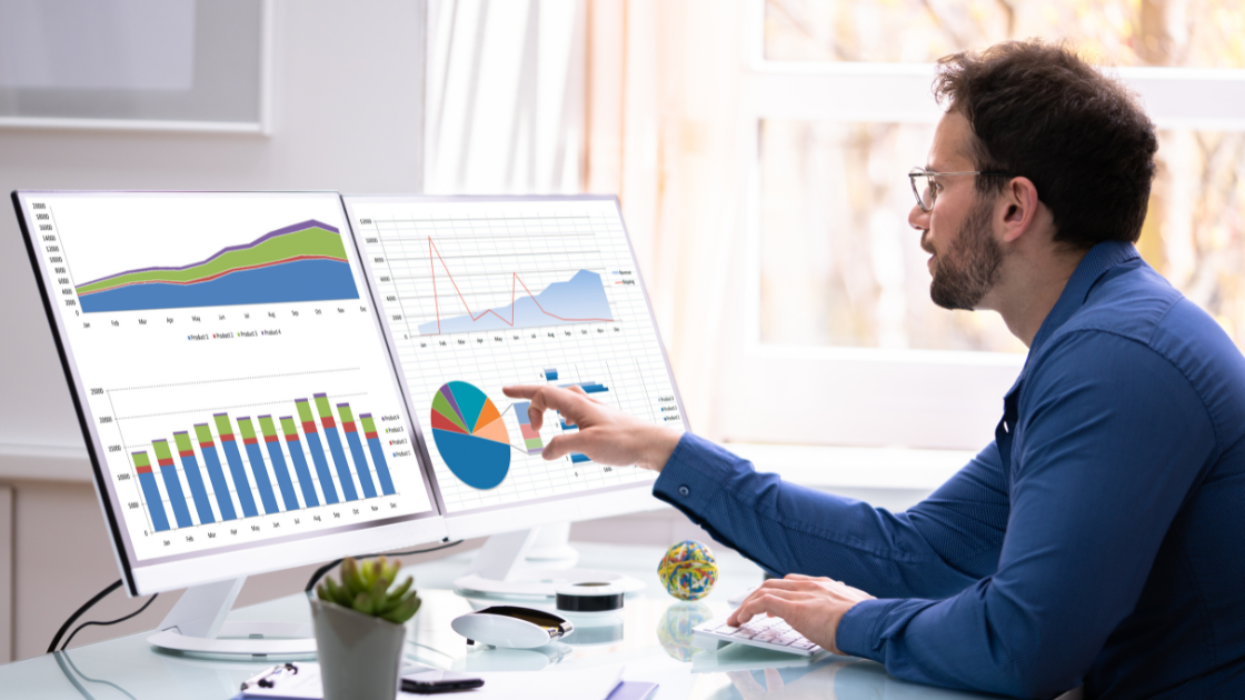 UK business professional analysing AI search changes data on laptop, representing calm strategic approach to digital marketing adaptation